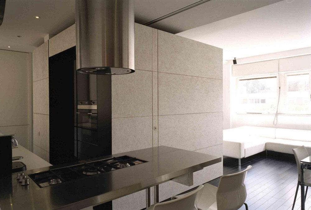 The kitchen perfectly matches the rest of the apartment interior design.