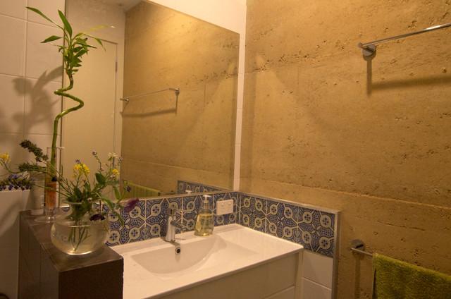 Bathroom with contemporary sink and green decorative flowers on it - Sustainable Home Interior Design - an Exciting Review