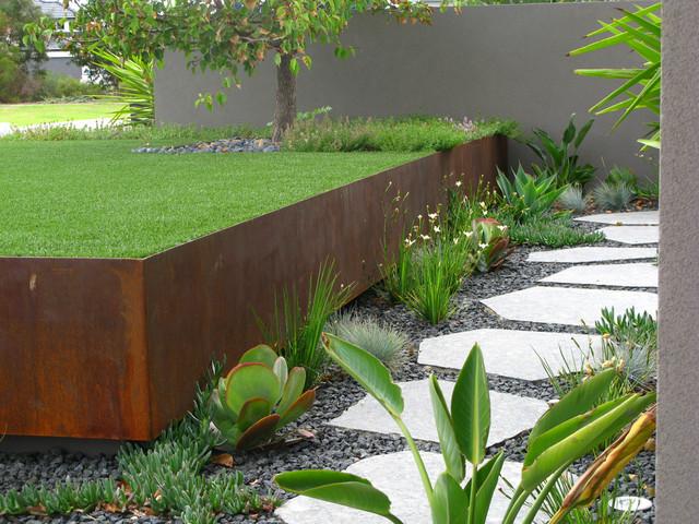 What is Big flat stones used as piles forming a garden path and how to use it 