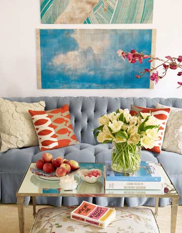 Colorful decorative pillows on a couch - 20 Decorating Secrets for your Cozy Home