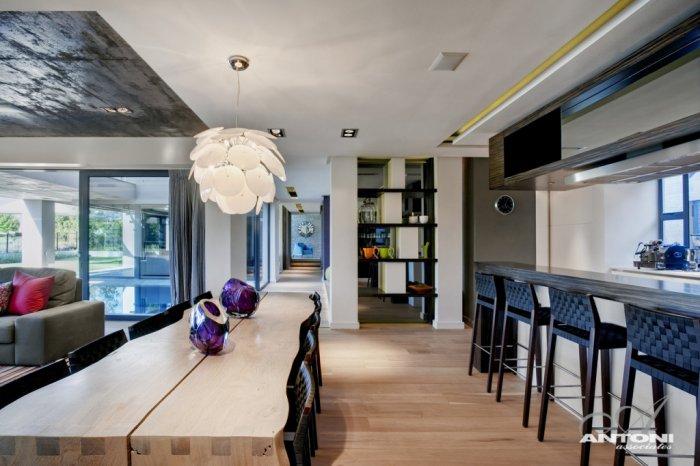 Wooden dining table design with creative hanging pendant above it - Contemporary and Luxury House Interior Design in Cape Town