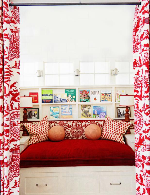 Decorative cushions on a bed with red cover - Small Room Ideas - Interior Design and Decoration