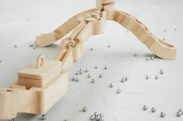 Wooden carvings in the table legs allow the children to play - Unique and Exciting Creative Design of a Wooden Table