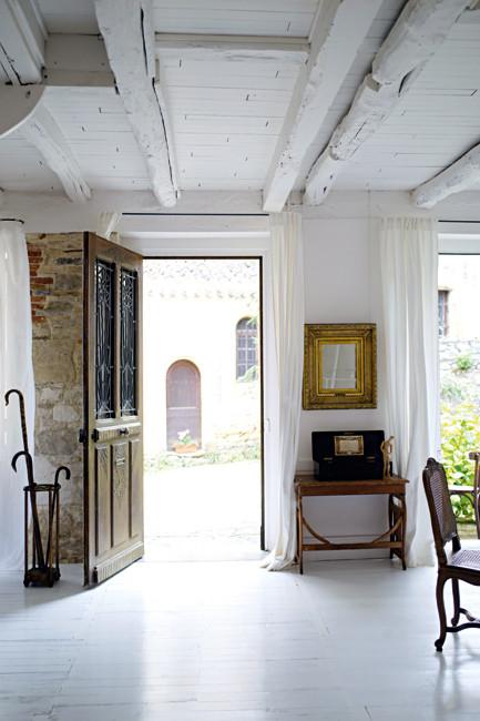 The wooden door at the main entrance - Rustic French Country Home Interior Design in Paris
