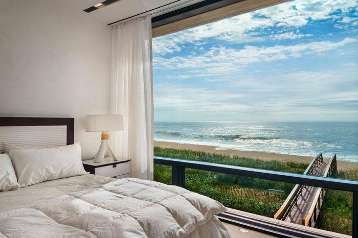 Bedroom design with beautiful view over the Atlantic ocean - Luxury Two Story Coastal House