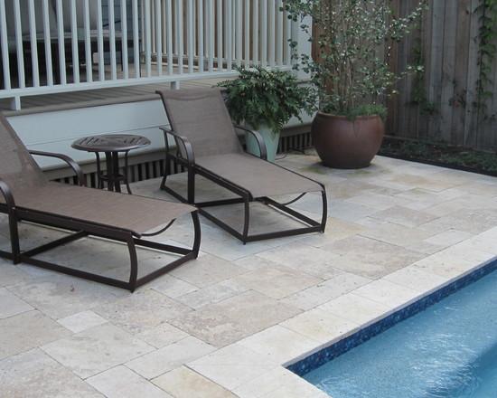 Lounge chairs at a swimming pool - How to Place a Garden Swimming Pool in a Small Yard 