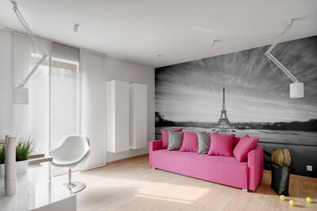 Pink sofa and decorative photo wallpaper of the Eifel Tower - Contemporary Family House in Poland with Minimalist Touch