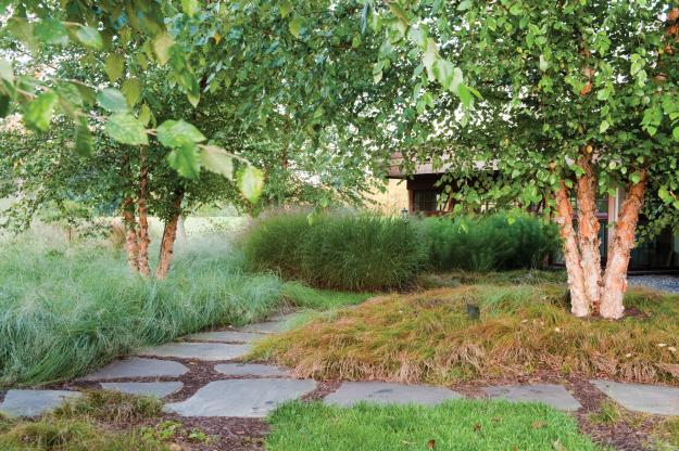 Stone pieces used as a garden path - Sustainable House with Beautiful Outdoor Garden Areas