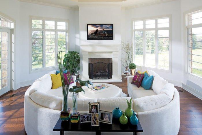Fireplace in a cozy white living room - Arrange the Fireplace as a Focal Point in Your Home