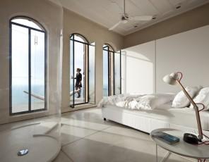 spacious bedroom design wit ha touch of white an transparent shower: Spectacular Ancient Seaside Penthouse in Tel Aviv