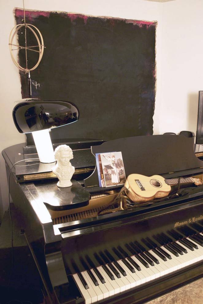 Eclectic decorations on a black grand piano - Loft in Vancouver with Vintage and Classic Touch