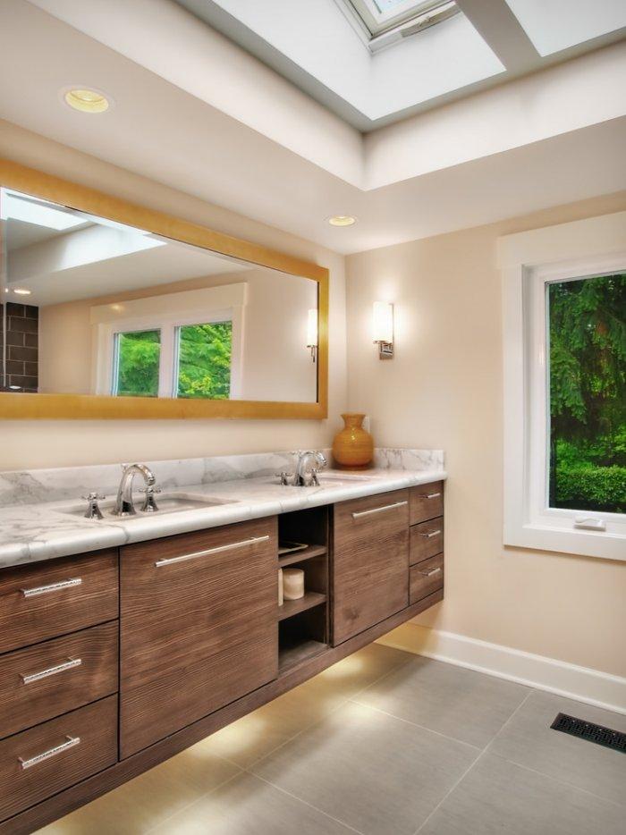 Modern bathroom vanity in brown colors and a horizontal mirror - Remodeling Ideas