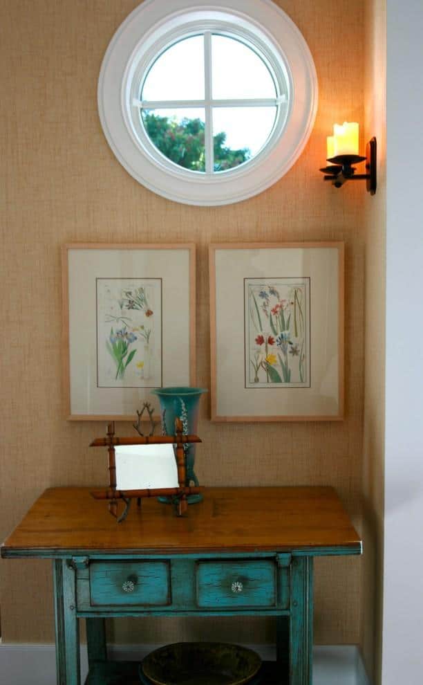 Vintage turquoise table and herbal illustrations above it - Beach Family House in Corona Del Mar, CA
