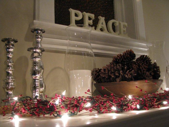 A garland of red berries and lights - 10 Simple and Elegant Christmas Decorating Ideas