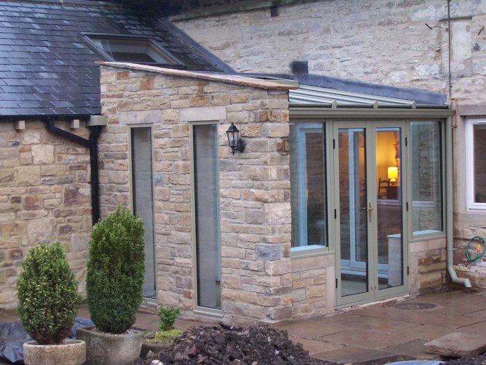 House entrance with stone cladding - Benefits of your bespoke conservatory