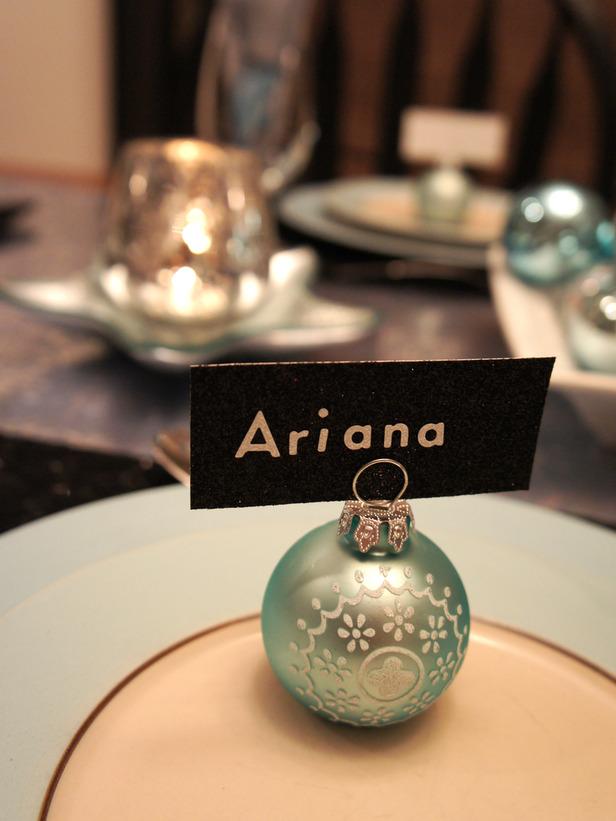 Blue ornament ball used as a card holder - 24 Dazzling Settings for a Sparkling Holiday Night