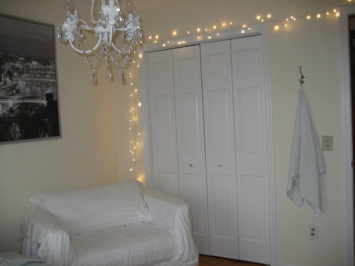  String lights placed above a bedroom closet - Casual Christmas Decoration