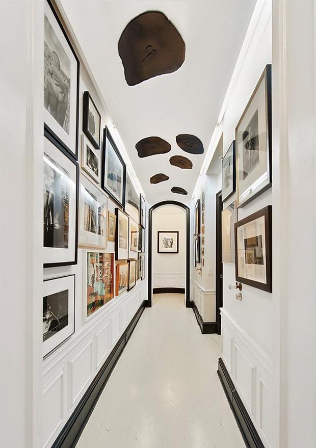 The hallway in the loft reveals a stylish art collection - $20 Million Luxury and Artful Interior of a New York Loft