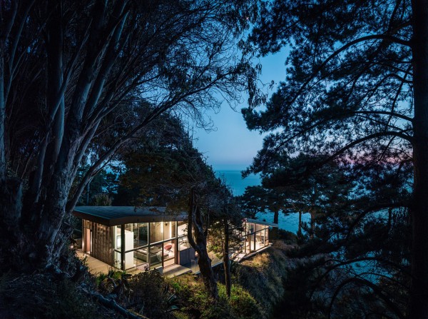 A view towards the lake and house at night-Spectacular Contemporary Glazed Lakeside Home in California