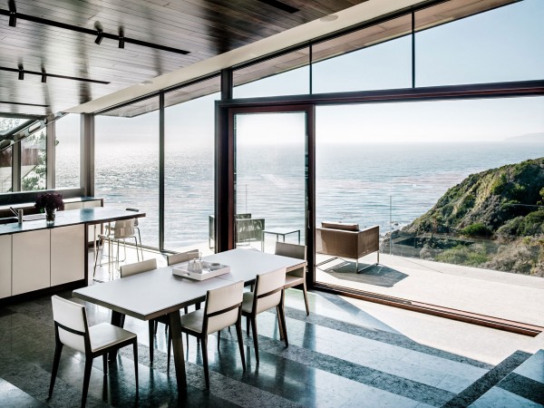 Breathtaking views over the lake from the dining area-Spectacular Contemporary Glazed Lakeside Home in California