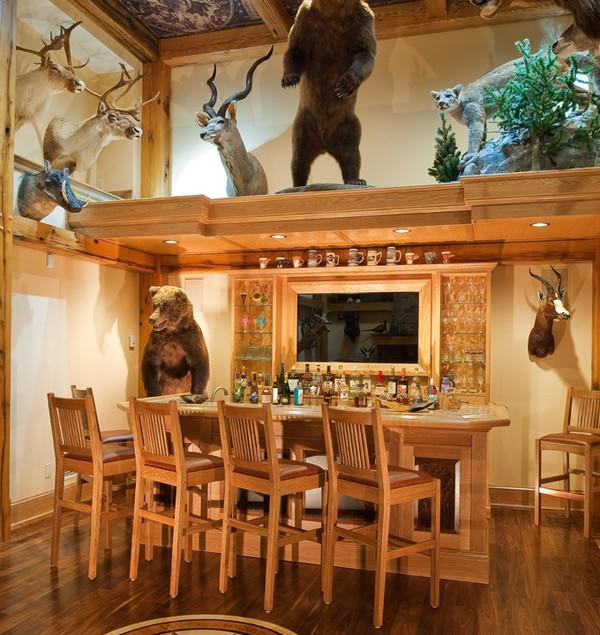 Modern home bar in natural wood color and with hunting trophies - Interior Design Trends - Having a Pub in the house