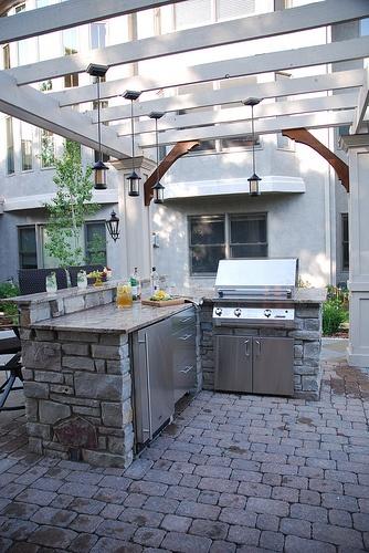modern-outdoor-kitchen-made-of-stone- 20 Ideas and Examples of Well-Arranged Outdoor Areas