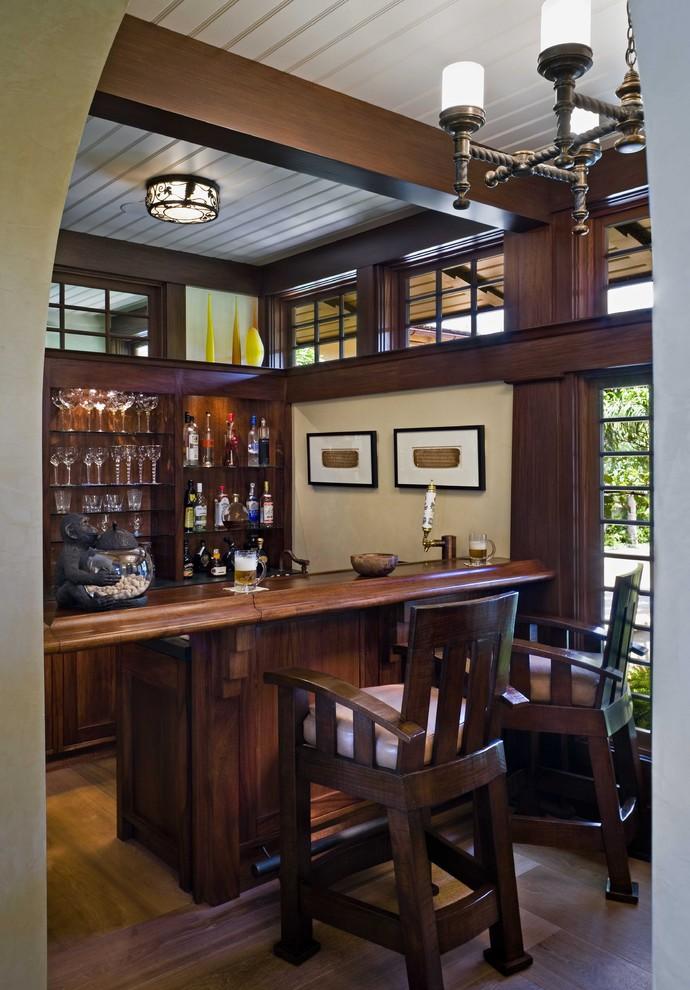small-home-bar-in-dark-and-moody-colors-located-in-the-basement