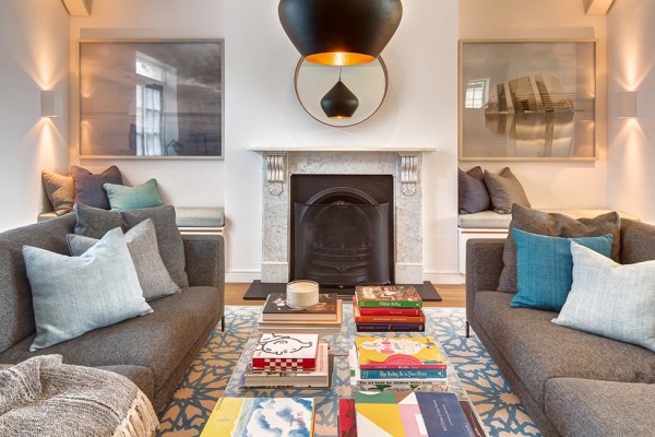 A fireplace located in the stylish living room+ Modern, elegant and sophisticated house in London