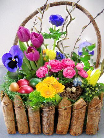 Attractive colorful Easter basket full of flowers