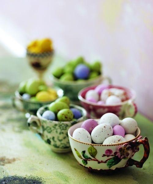 Chinese porcelain tea cups full of colorful eggs