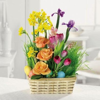 Eeaster basket full of roses, tulips and other flowers