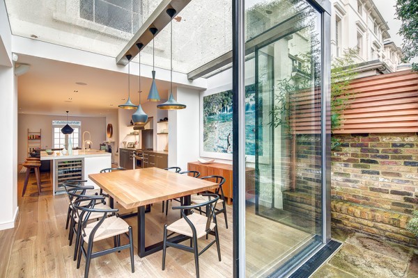 Huge glass sliding doors provide access to the garden+ Modern, elegant and sophisticated house in London