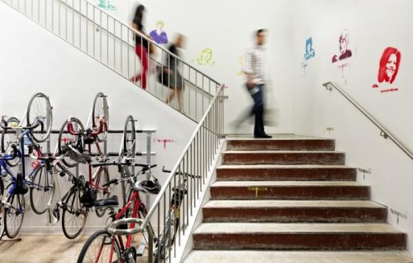 Indoor bike parking and stairs leading to the second level of the office