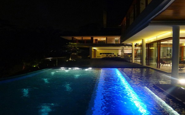 Luxurious residence swimming pool at night- Expensive Property in Singapore and its impressive interior design and architecture