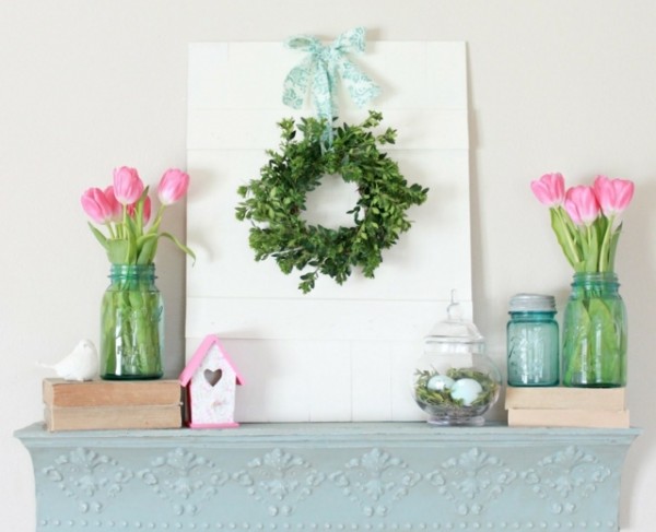 Natural green wreath, hurricane jars and pink tulips-Fantastic Easter Fireplace Mantle Decorating Ideas