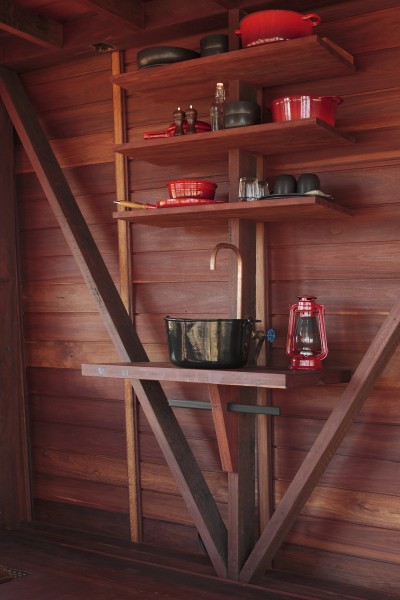 Simple copper sink and wooden shelves above it-Small Copper Tower Family Weekend Getaway in North Wales