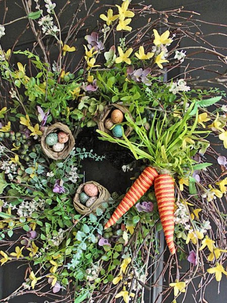 Small Easter nests witth eggs and decorative carrots in the garden – home decorating ideas for funny and joyful atmosphere