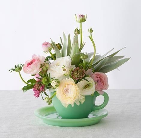 Tea cup full of fresh flowers