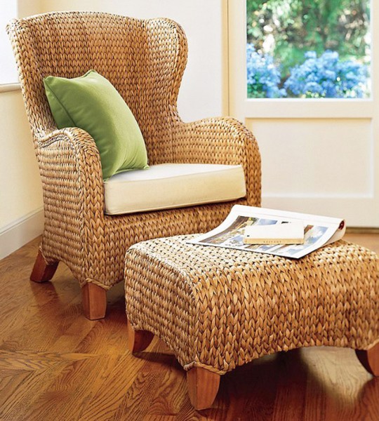 Comfortable armchair and foot stool made of natural materials-Eco elements in residential interior