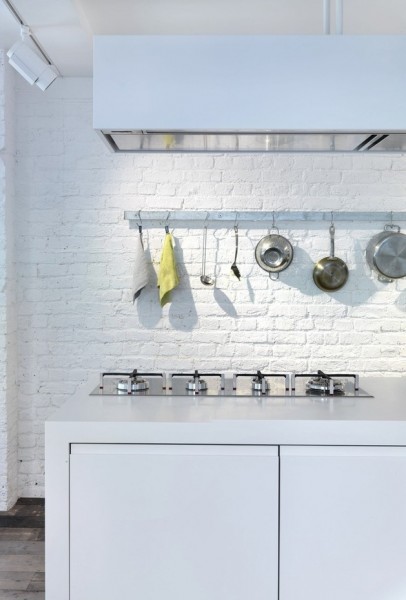 Kitchen with bricks painted in white-Luxurious minimalist loft interior design