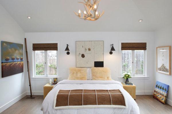 Master bedroom with moderate bed and two windows on its both sides