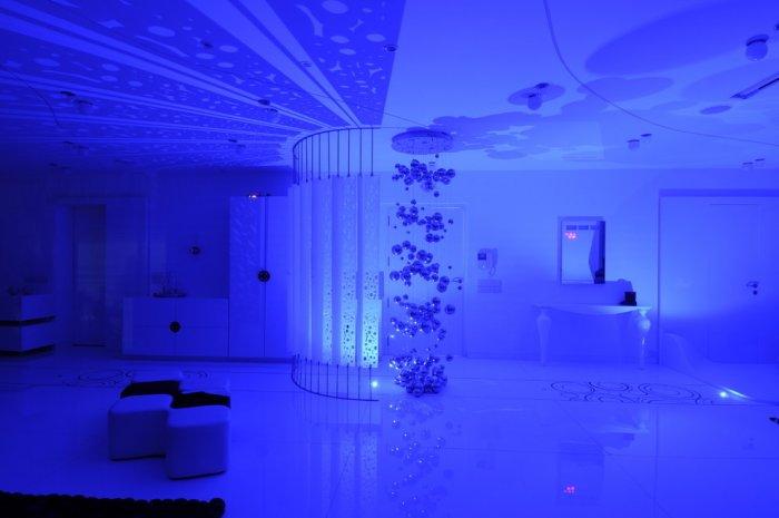 Blue interior in a luxurious home illuminated by LED lighting