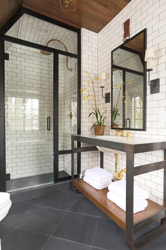 Chic bathroom with modern shower cabin and white brick tiles