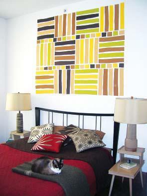 Chocolate colored wall art deco inside a modern bedroom