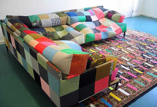 Colorful sofa and graphic rug of patterns of patches