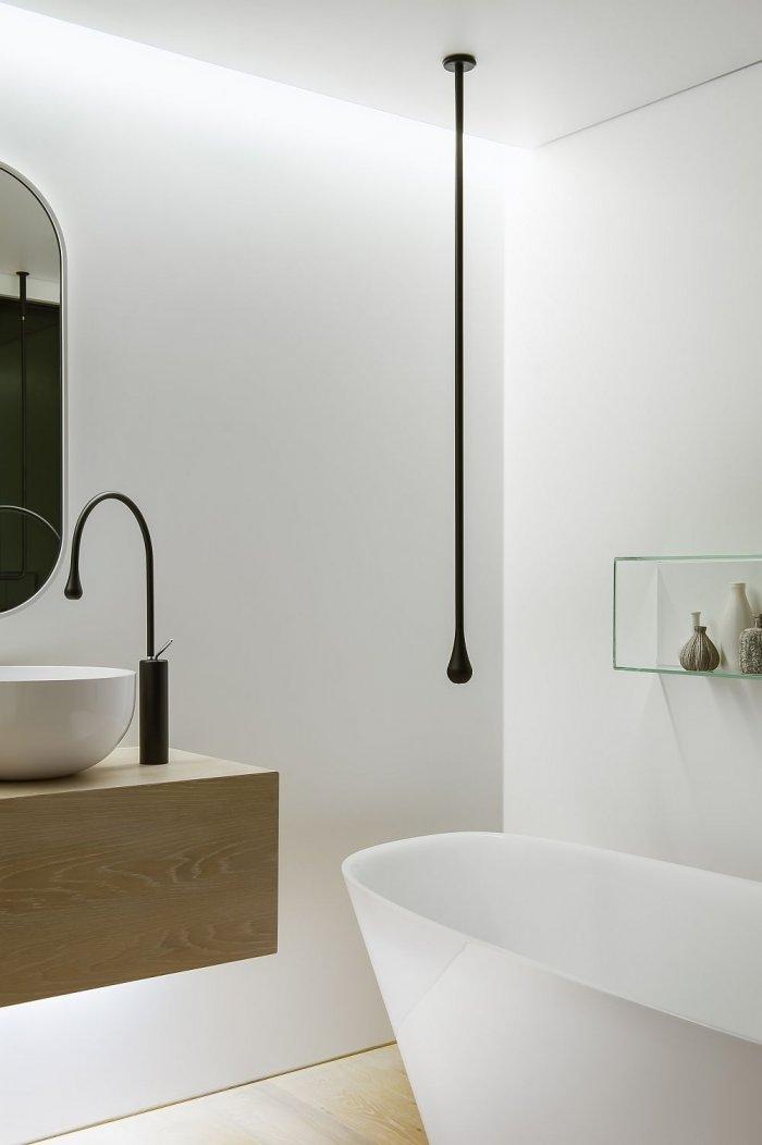 Contemporary bathroom with bathtub and modern sink vanity