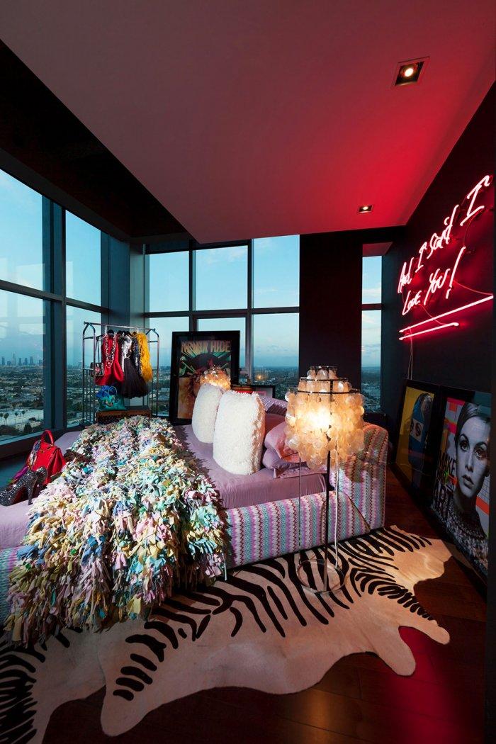 Eclectic bedroom with avantgarde decor and luxurious bed
