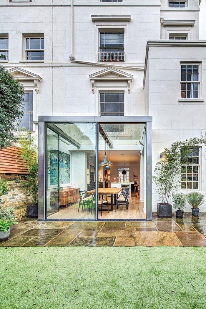 English home facade with glazed cubic room for dinner