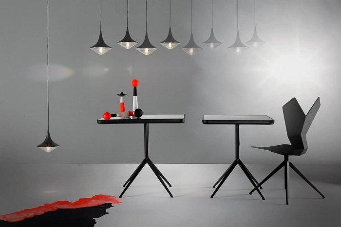 Futuristic chair, minimalist tea tables and modern pendants in British Gentleman’s Club