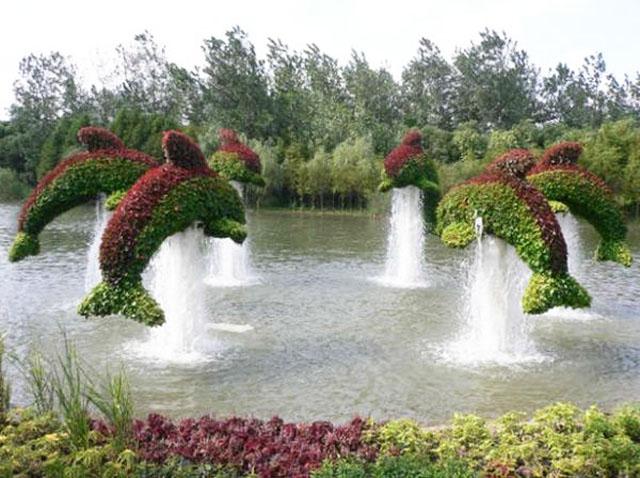 Garden art sculpture - dolpins diving into the water